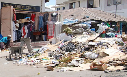 Uncollected garbage outside a "fashion center" in downtown Dar.